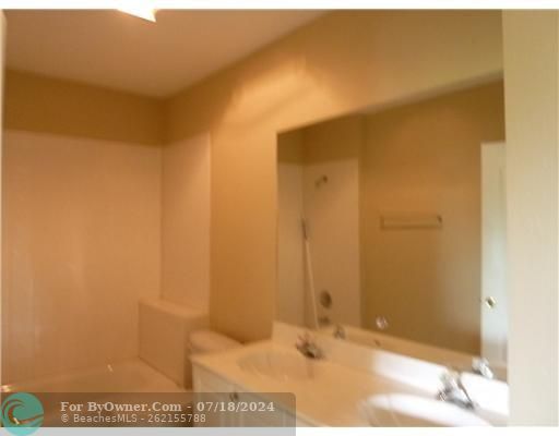 HALL BATH HAS DUAL SINKS & COMBO TUB/SHOWER