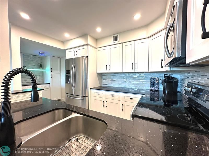 SS appliances and spectacular lighting.