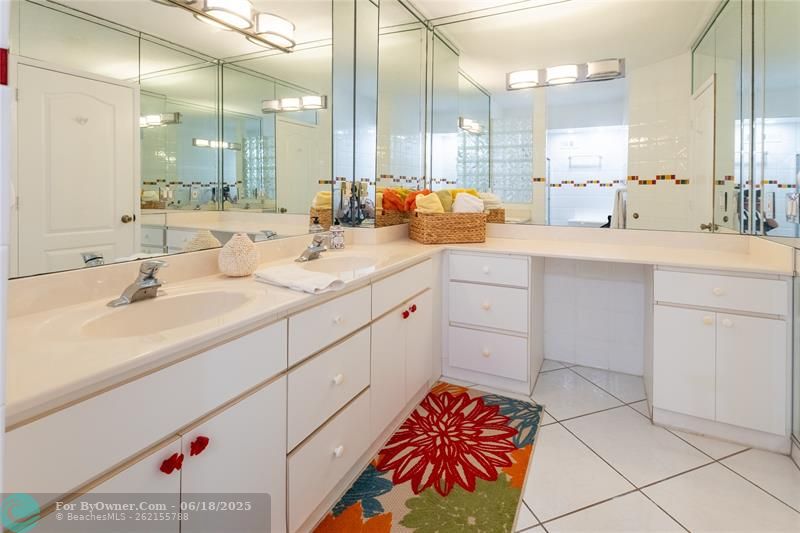 Master bathroom with dual sinks vanities