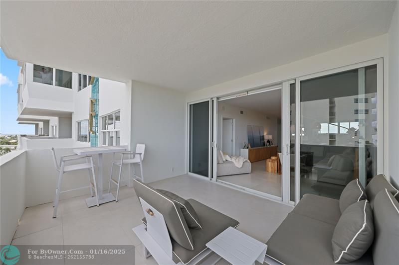 Outdoor balcony with impact glass sliders