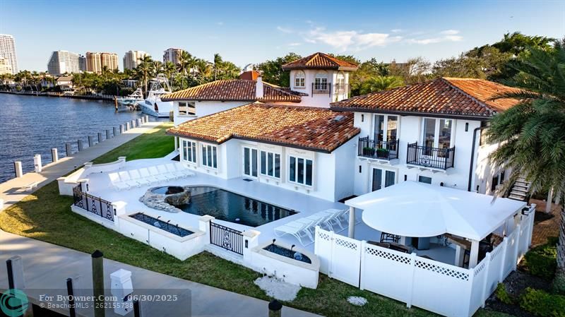 Aerial showing the entire pool area with outdoor kitchen.