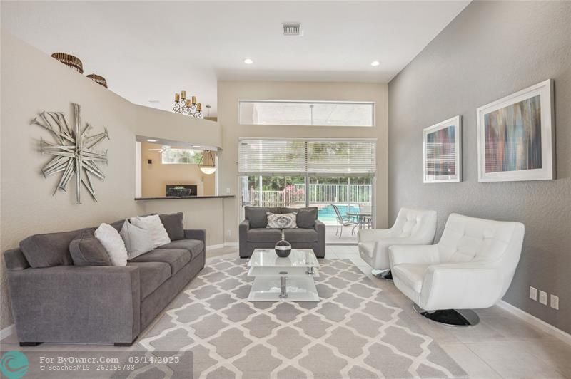 Spacious living room with full views to patio