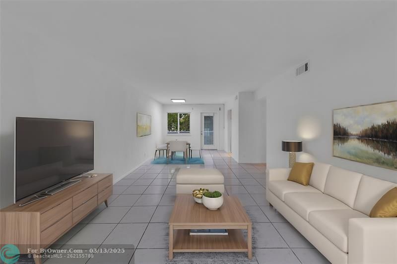 Living room and dining room are spacious and offer tile flooring - staged photo