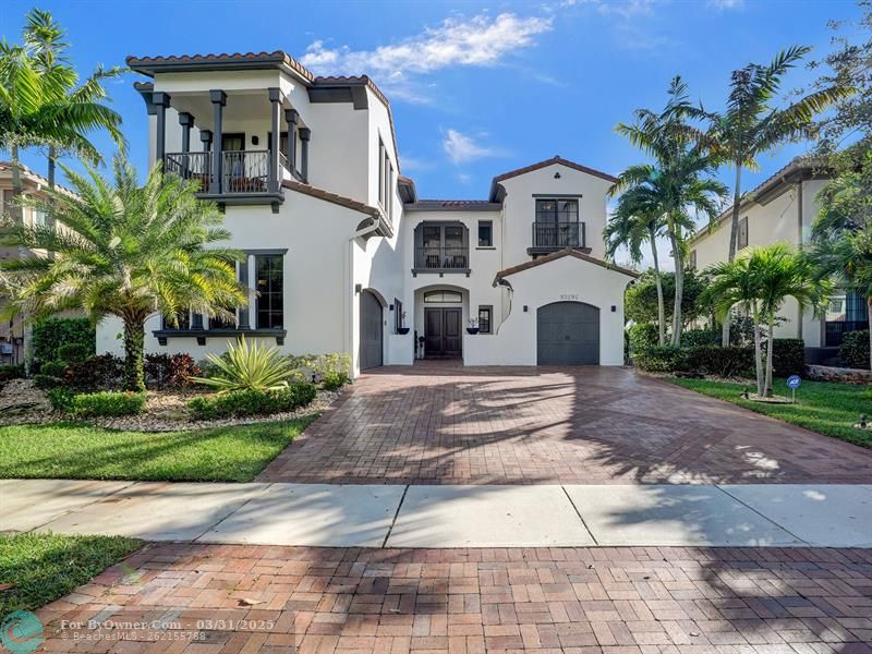 A generous driveway guides you to a 3-car garage equipped with a built-in tool closet. Multiple balconies enhance both charm and functionality in this nearly 5,000 sqft home.