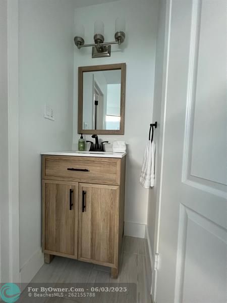Guest Bedroom with private back yard view, Fantastic Transom windows add style and natural light, ALL Bedrooms are en-suite w/ Full Baths