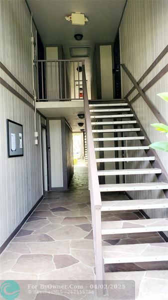 Stairs to Property. First door on the Left.