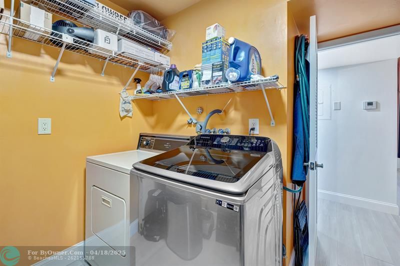 Washer and dryer in in-unit Storage room.