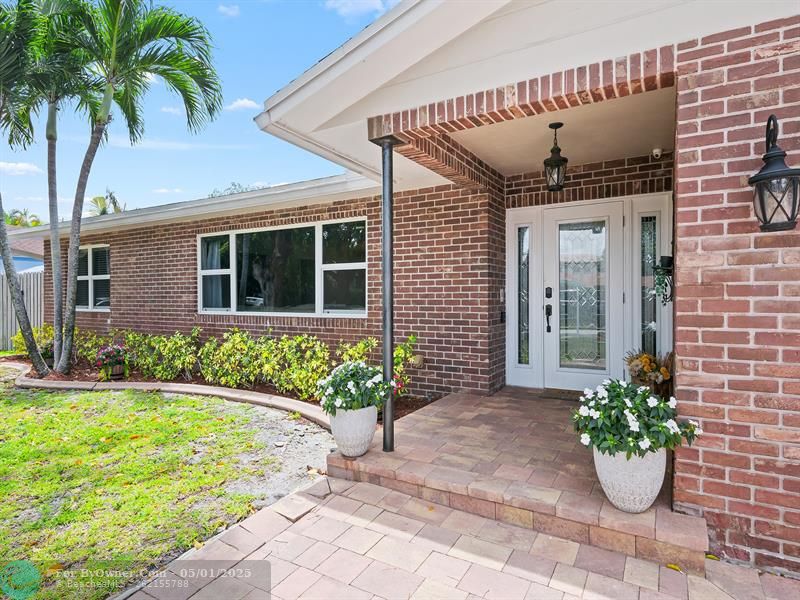 Charming entryway with great curb appeal, inviting you into a beautifully maintained interior