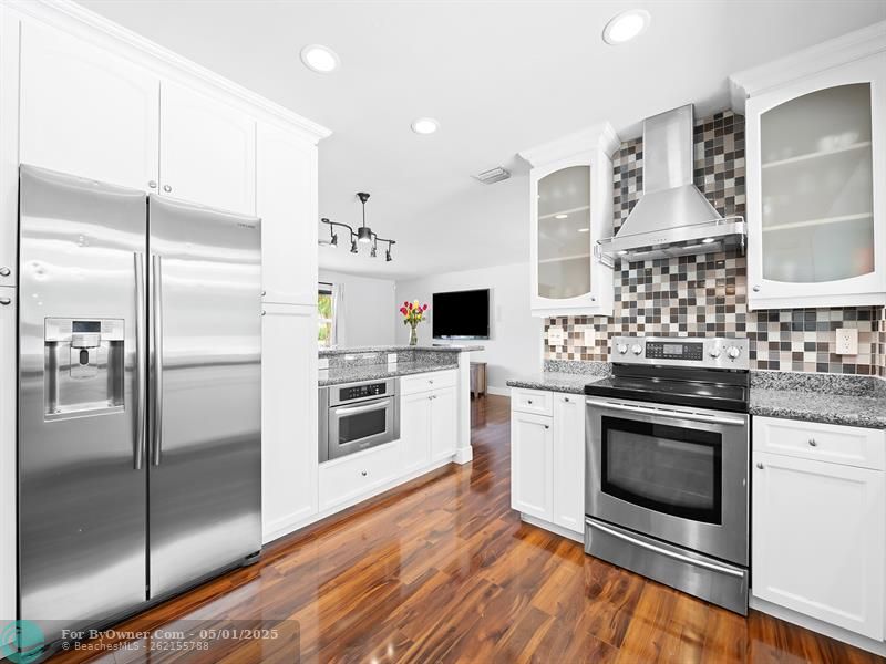 Freshly updated kitchen overlooking the beautiful backyard and pool