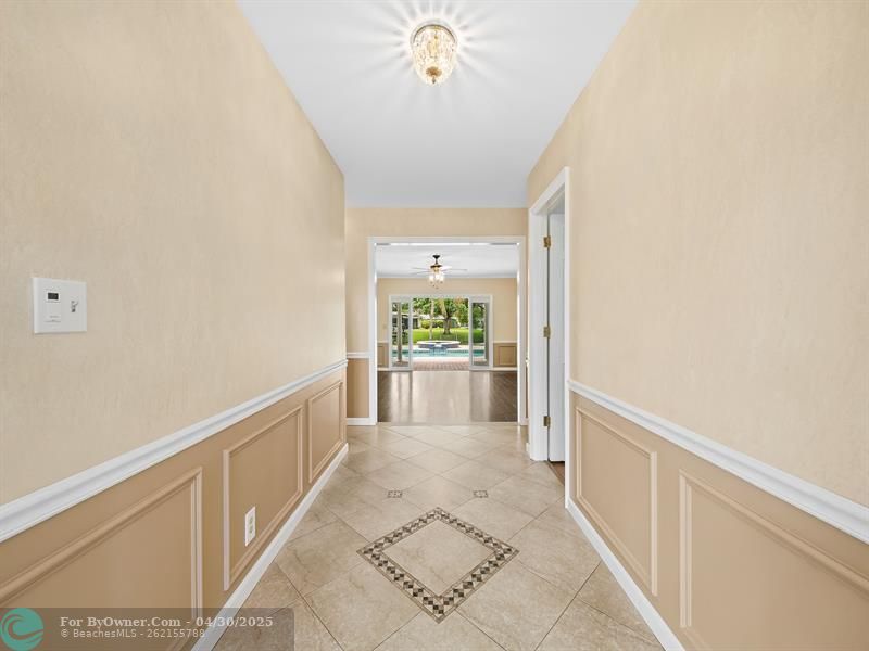 Entrance/Foyer view streams your eyes immediately to your gorgeous backyard.