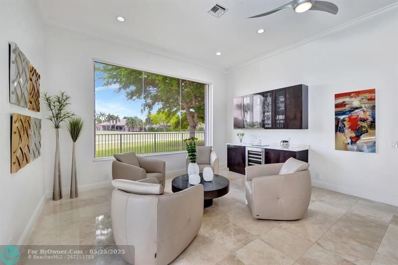 Optional game room is an extended entertainment lounge with built-in bar with marble counters & wine refrig.