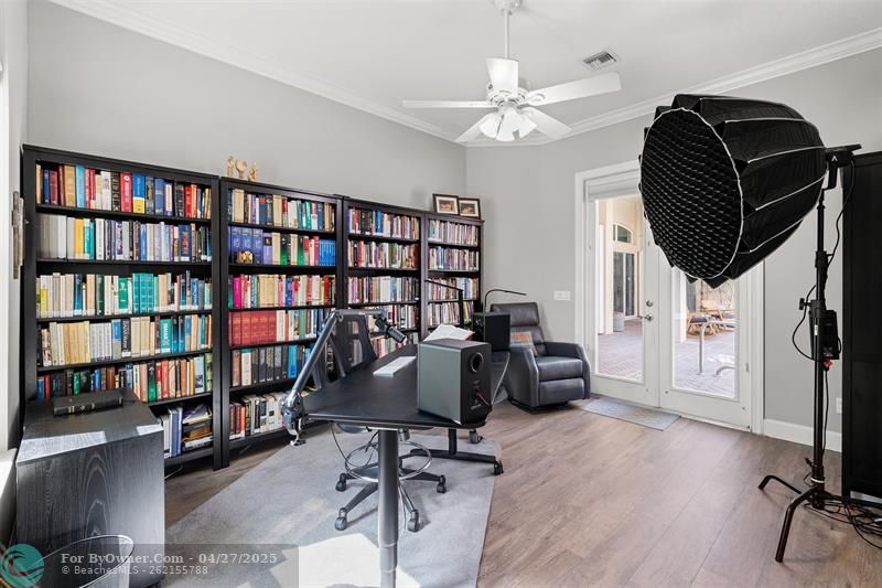Completely Separate Guest quarters, Studio, Office, or more.  Double hung Glass Doors overlook Pool.  Flooring updated.
