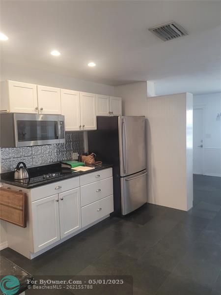 Kitchen looking back to entry