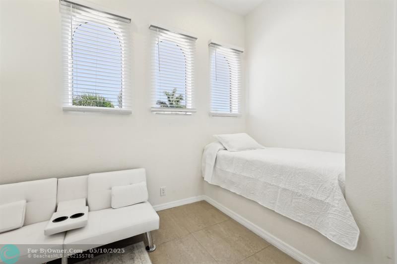 Second-Floor Bedroom – currently used as a home office, this versatile space features a custom built-in bed and convenient access to a nearby full bathroom (not en-suite), making it ideal for guests, work, or relaxation.
