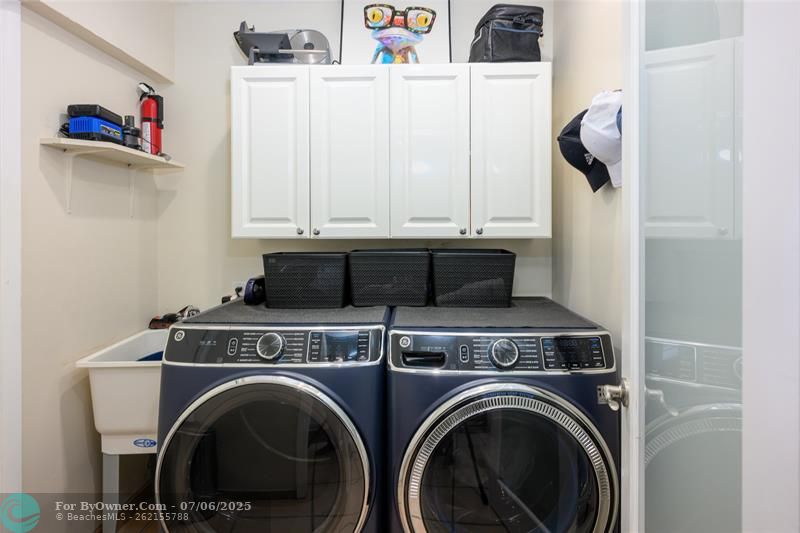 Laundry off kitchen leads to garage with \