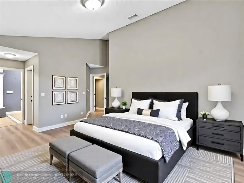 Virtually Staged Bedroom of the 1st Floor Primary Suite, which leads to Primary Bath