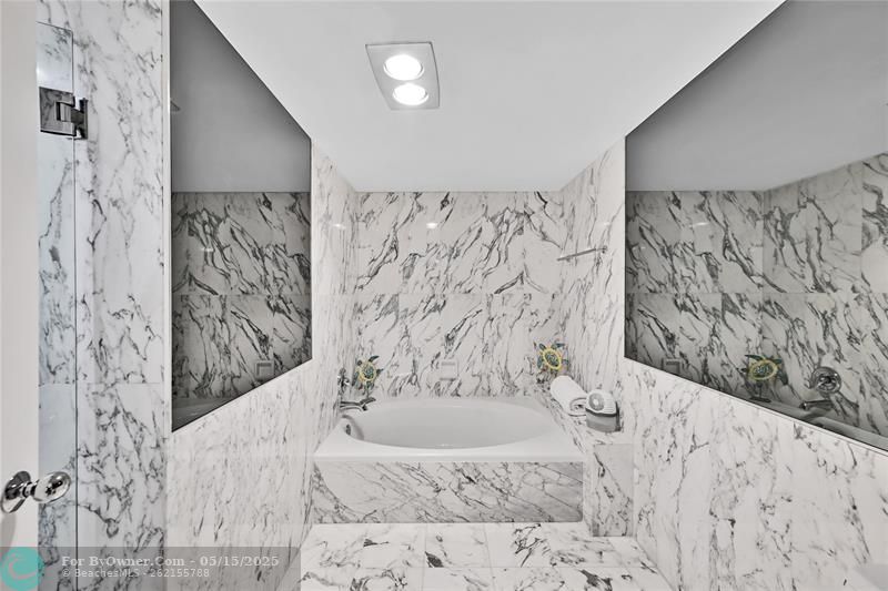 Full bathroom with bathtub and separate shower