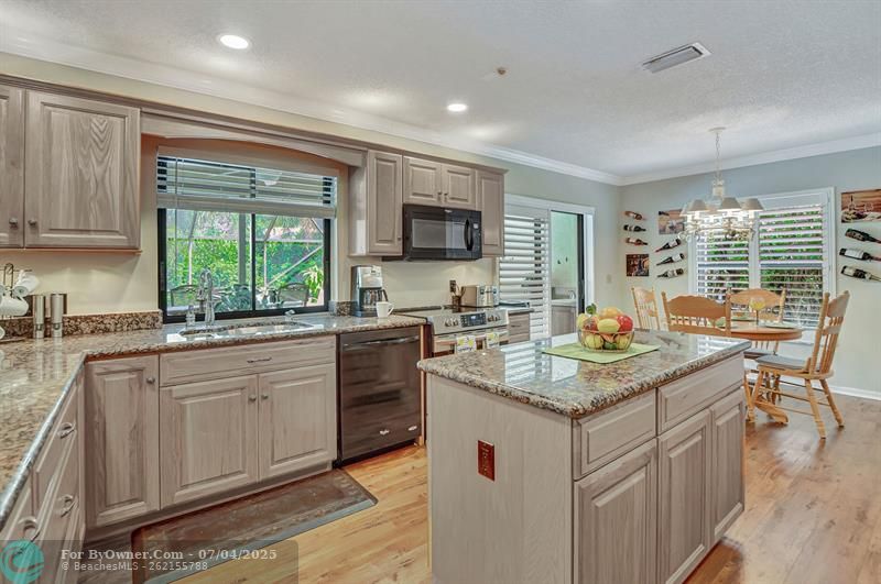 Tons of cabinets and granite counters.