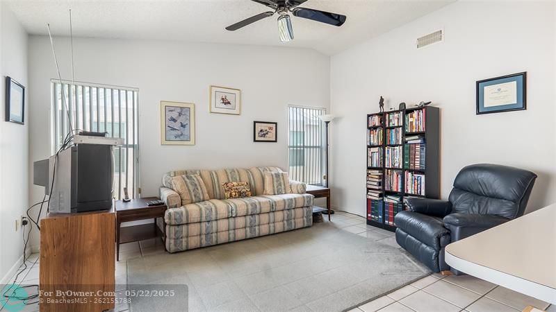 Family room. Light and bright. High ceilings and easy care tile flooring.