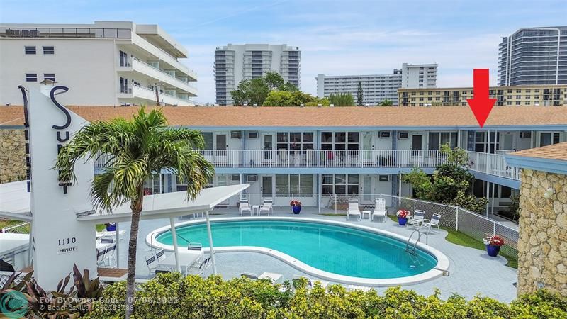 This Second Floor Poolside Retreat Boasts Impact Windows & Doors, Retractable Screen Door, Three Friedrich A/C units (One with Heat, 2023 & 2024), 2012 Water Heater, & Ceramic Tile and Oak Laminate Floors.