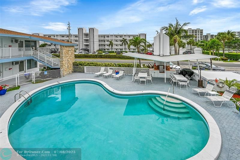 Take in the Florida Sun Relaxing or Entertaining Poolside. Community includes Heated Pool, Covered Cabana Area with BBQ, Lots of Pool Lounge Chairs & Seating, Surrounded by Lush Landscape, Plants & Flowers!