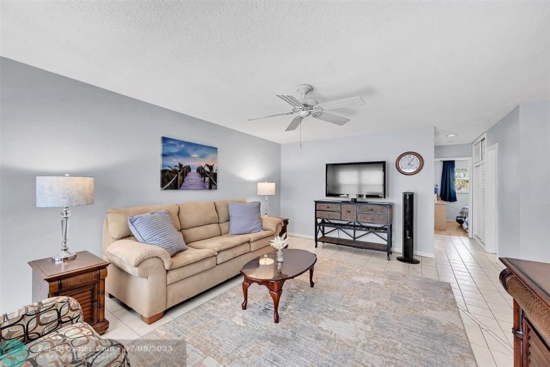 Your Furnished Living Room includes a Queen Sized Sofa Bed, Impact Windows and Doors with Blinds and Retractable Screen Doors! Bright, Open, Spacious and Ready for You and Your Family and Friends to Enjoy!