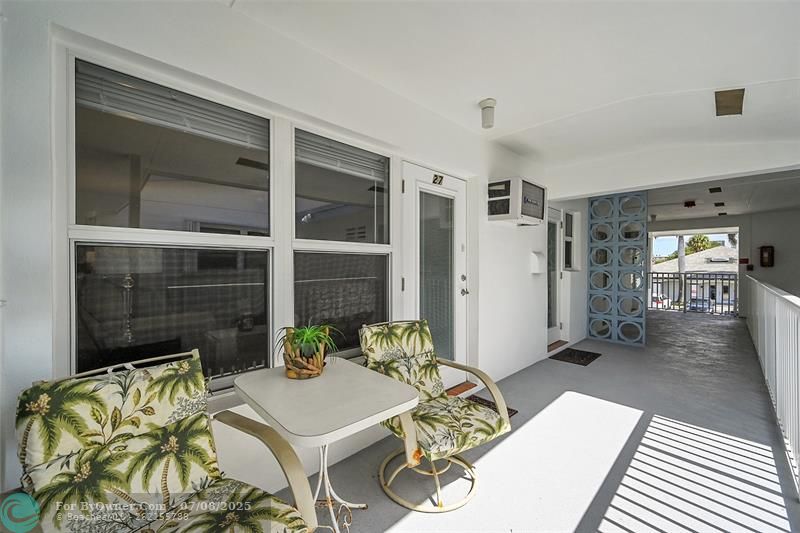 This is Your Oversized Balcony Perfect for Relaxing or Entertaining! All Impact Windows & Both Doors also have Blinds & Retractable Screen Doors, Furnished & Ready for you to Enjoy the Fresh South Florida Air & Lifestyle!