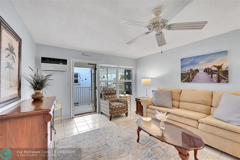 Retractable Screen Doors Shown Here are included in Your Living Room and Kitchen for a No Bug Zone. Can you feel the South Florida Breeze Already?