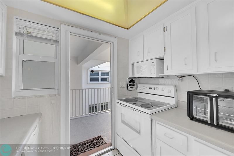 Retractable Screen Doors Shown Here are included in Your Living Room and Kitchen for a No Bug Zone. Can you feel the South Florida Breeze Already?