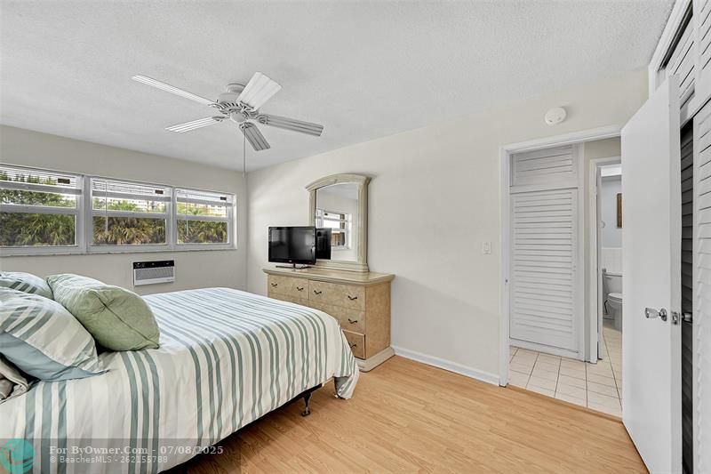 Newer Friedrich Wall AC, Impact Windows and Blinds Included. Primary Bedroom is Furnished with a King Sized Furniture Suite and still has room for a Seating, Reading or Desk Area if needed.