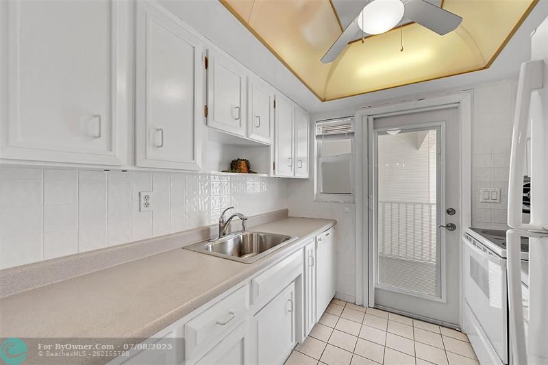Your Kitchen Features lots of Cabinet Space, is Bright & Has A Door to Your Balcony! Being Sold Furnished, Turn-Key. Impact Windows & Doors also include Blinds and Retractable Screen Doors!