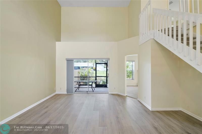 Living room with screened patio and view of canal