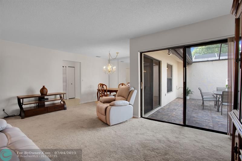 LARGE SLIDING DOORS OPEN UP TO YOUR PRIVATE PATIO