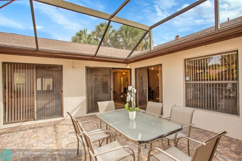 3 SETS OF SLIDING DOORS TO ENTER YOUR PRIVATE SCREENED IN PATIO AREA. ONE IS FROM THE BEDROOM.