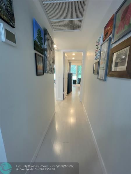 Hallway Entrance to Bedrooms, Bathrooms & Patio