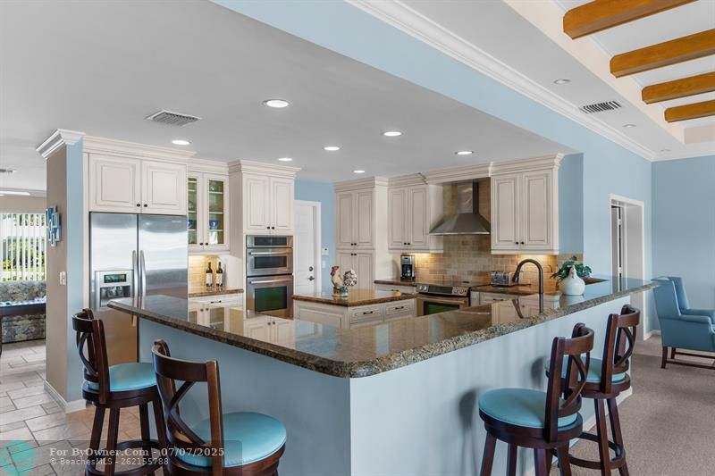 Kitchen is open to the Florida Room with awesome water views