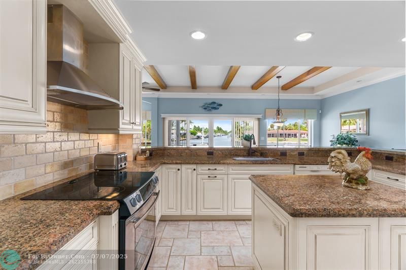 Kitchen sink area looks out to Florida Room and waterway