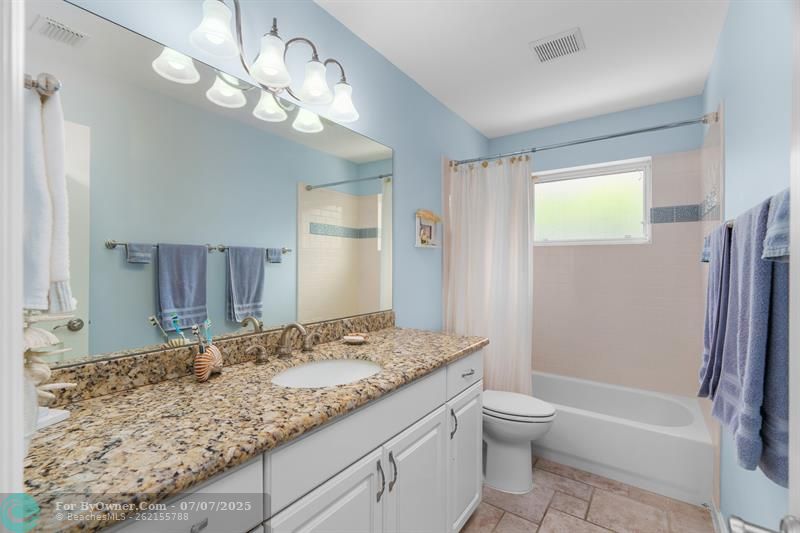 Hallway Bathroom separates the 2 Bedrooms on the east side