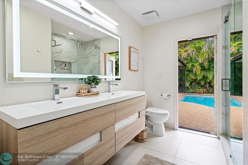 Luxury cabana bath has all the bells and whistles of a lux hotel!